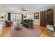 Comfortable living room with hardwood floors, recessed lighting, and access to an outdoor deck at 3287 Alton Rd, Atlanta, GA 30341