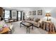 Sophisticated living room featuring stylish furniture, decorative lamps, and geometric-patterned rug at 3287 Alton Rd, Atlanta, GA 30341