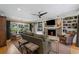 Inviting living room with a stone fireplace, custom shelving, and ample natural light at 3287 Alton Rd, Atlanta, GA 30341