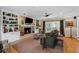 Bright living room boasts a fireplace, built-in bookcases, and French doors to outdoor space at 3287 Alton Rd, Atlanta, GA 30341