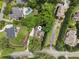 Overhead shot of house with long driveway, mature trees, and a rectangular pool at 3809 Wieuca Ne Rd, Atlanta, GA 30342
