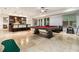 Finished basement features travertine flooring, bar area, and a pool table for entertaining at 3809 Wieuca Ne Rd, Atlanta, GA 30342