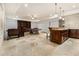 Basement is a spacious area with travertine floors, pool table, kitchenette and abundant lighting at 3809 Wieuca Ne Rd, Atlanta, GA 30342