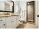 Bathroom with granite countertop vanity, framed mirror, and a glass door walk-in shower at 3809 Wieuca Ne Rd, Atlanta, GA 30342