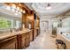 Large bathroom with double vanity, soaking tub, glass shower, and access to the walk-in closet at 3809 Wieuca Ne Rd, Atlanta, GA 30342