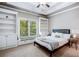 Cozy bedroom with built-in shelving and window seat, providing a comfortable and inviting space at 3809 Wieuca Ne Rd, Atlanta, GA 30342