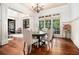 Bright dining room with hardwood floors, wainscoting, large windows, and chandelier at 3809 Wieuca Ne Rd, Atlanta, GA 30342