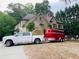 Estate exterior featuring truck with hay and horse trailer parked on the grounds at 3809 Wieuca Ne Rd, Atlanta, GA 30342