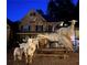 Exterior shot of a stone house with goats gathering on a bench at dusk at 3809 Wieuca Ne Rd, Atlanta, GA 30342