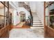 Elegant foyer featuring hardwood floors, a grand staircase, and an arched entryway at 3809 Wieuca Ne Rd, Atlanta, GA 30342