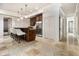 Bright kitchen with stone floors, stainless steel appliances, breakfast bar, and ample storage at 3809 Wieuca Ne Rd, Atlanta, GA 30342