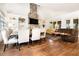 Inviting living room featuring a stone fireplace, built-in bookshelves, and ample natural light at 3809 Wieuca Ne Rd, Atlanta, GA 30342