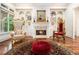 Living room with hardwood floors, fireplace, built-in shelves and sitting chairs at 3809 Wieuca Ne Rd, Atlanta, GA 30342