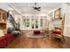 Spacious living room with hardwood floors, coffered ceilings, and fireplace at 3809 Wieuca Ne Rd, Atlanta, GA 30342