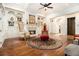 Spacious living room with hardwood floors, coffered ceilings, fireplace, and sitting chairs at 3809 Wieuca Ne Rd, Atlanta, GA 30342