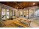 Covered stone patio with brick walls, wood ceiling, and a picnic table for outdoor dining at 3809 Wieuca Ne Rd, Atlanta, GA 30342