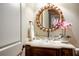 Charming powder room featuring a glass bowl sink, decorative mirror, and stylish fixtures at 3809 Wieuca Ne Rd, Atlanta, GA 30342