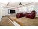 Home theater room with tiered seating, projector, and large screen for immersive movie nights at 3809 Wieuca Ne Rd, Atlanta, GA 30342