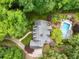 Aerial view showcasing a meticulously landscaped property with a pool, spa, and inviting outdoor spaces at 530 Twinflower Ct, Roswell, GA 30075