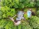Lush backyard featuring a sparkling pool, spa, and ample seating areas for outdoor relaxation and entertainment at 530 Twinflower Ct, Roswell, GA 30075