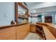 Home bar complete with glassware, storage, lighting and a sink, perfect for entertaining friends at 530 Twinflower Ct, Roswell, GA 30075