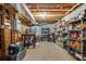 Unfinished basement with exposed ceiling, shelving, and ample storage space, ready to be customized at 530 Twinflower Ct, Roswell, GA 30075