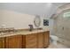Bathroom with vanity, granite countertop, decorative mirror, toilet, and glass-enclosed shower at 530 Twinflower Ct, Roswell, GA 30075