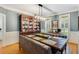 Elegant dining room with stylish lighting, a built-in cabinet, and comfortable seating for dinner parties at 530 Twinflower Ct, Roswell, GA 30075
