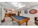 Game room with pool table, bar, and lounge area for entertaining friends and Gathering at 530 Twinflower Ct, Roswell, GA 30075
