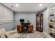 Home office with built-in shelves, desk, and chair. A comfortable space for working from home at 530 Twinflower Ct, Roswell, GA 30075