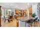 Well-lit kitchen with modern appliances, countertops, hardwood floors and connected breakfast nook at 530 Twinflower Ct, Roswell, GA 30075