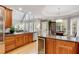 Bright kitchen with granite countertops, stainless steel appliances, and a view of the breakfast nook at 530 Twinflower Ct, Roswell, GA 30075