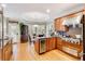 Spacious kitchen with wood cabinets, stainless appliances, and a breakfast nook with natural light at 530 Twinflower Ct, Roswell, GA 30075