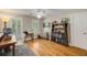 Bright office with hardwood floors, large windows, custom desk, and shelves at 530 Twinflower Ct, Roswell, GA 30075