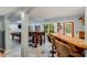 Spacious recreation room with a pool table, bar seating, and natural light for entertaining guests at 530 Twinflower Ct, Roswell, GA 30075