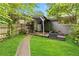 A charming backyard with a covered patio, grill, and cozy seating area create an inviting outdoor space for relaxation at 1176 Cardinal Ne Rd, Conyers, GA 30012