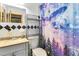 Bathroom featuring an astronaut-themed shower curtain and updated sink at 1176 Cardinal Ne Rd, Conyers, GA 30012