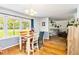 Bright dining room with hardwood floors adjacent to living area at 1176 Cardinal Ne Rd, Conyers, GA 30012