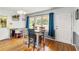 Cozy dining room with hardwood floors and a view of the front yard at 1176 Cardinal Ne Rd, Conyers, GA 30012