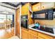 Galley kitchen view looking into a dining room with hardwood floors at 1176 Cardinal Ne Rd, Conyers, GA 30012