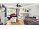 Comfortable living room with hardwood floors, a ceiling fan, and plenty of natural light at 1176 Cardinal Ne Rd, Conyers, GA 30012