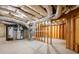 Unfinished basement with exposed duct work, stud walls, and concrete floor at 2595 Glaramara Ter, Cumming, GA 30041