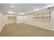 Finished basement space with carpet flooring, recessed lighting, and built in shelving at 2595 Glaramara Ter, Cumming, GA 30041