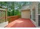 Exterior wooden deck overlooking lush trees at 2595 Glaramara Ter, Cumming, GA 30041