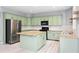 Kitchen with granite countertops, stainless steel appliances, and painted cabinetry at 2595 Glaramara Ter, Cumming, GA 30041