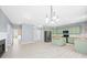 Open eat-in kitchen with painted cabinets, island, and stainless steel appliances at 2595 Glaramara Ter, Cumming, GA 30041
