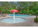 Community swimming pool with mushroom water feature, lounge chairs, and mature trees at 2595 Glaramara Ter, Cumming, GA 30041