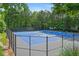 Community tennis and pickleball courts with new blue surfacing and mature trees at 2595 Glaramara Ter, Cumming, GA 30041