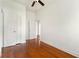 Bedroom featuring hardwood floors, neutral walls, ceiling fan and a double-door closet at 3288 Dogwood St, Atlanta, GA 30337