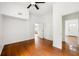 Bedroom with hardwood floors, neutral walls, ceiling fan and access to other rooms at 3288 Dogwood St, Atlanta, GA 30337